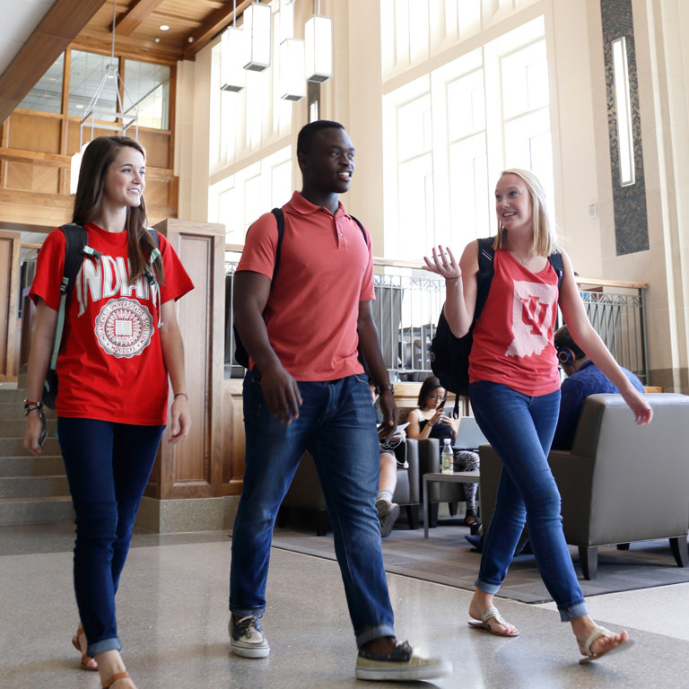 A group of students walks together in Hodge Hall.